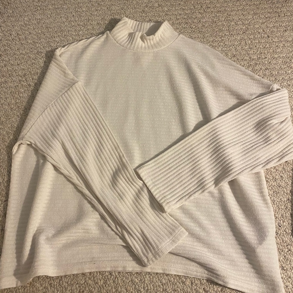 White flowy turtleneck sweater